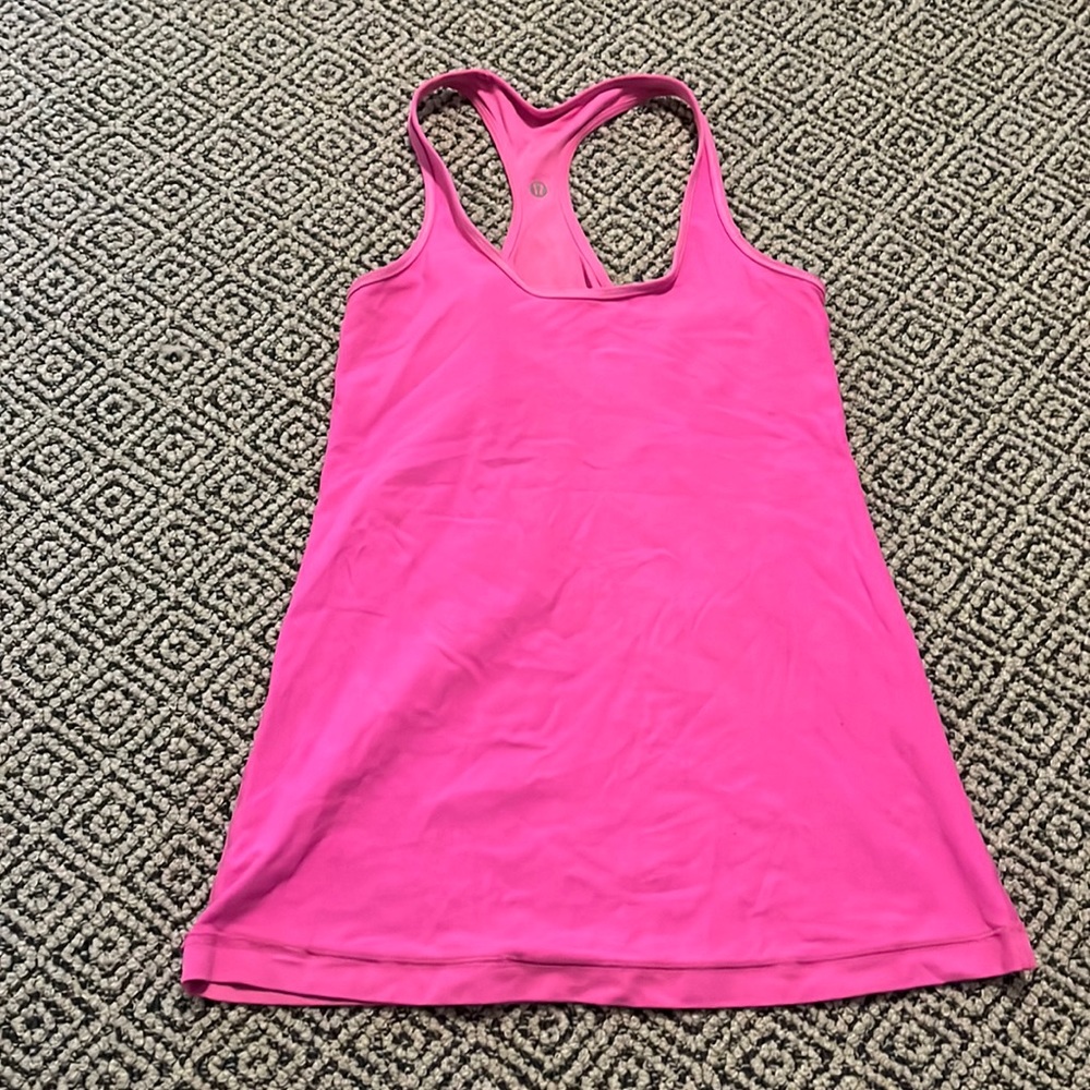 Bright pink swiftly tech racer back tank top.